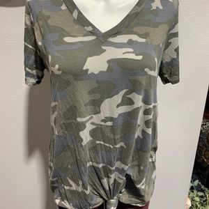 Camo top with a tied not at the bottom.